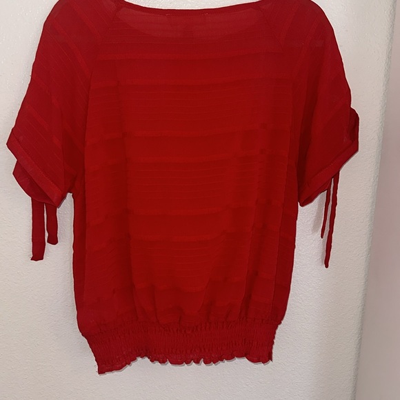 Sheer red blouse size medium with reaching at the bottom and ties on on side - Picture 7 of 8